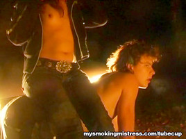 Smoking Mistress Sits on Slave