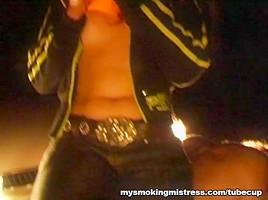 Smoking Mistress Sits on Slave