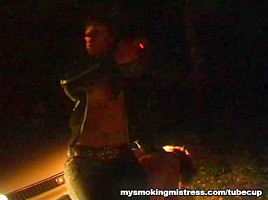 Smoking Mistress Sits on Slave