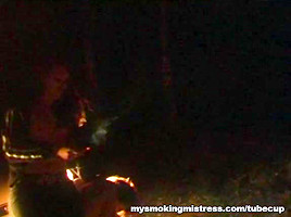 Smoking Mistress Sits on Slave