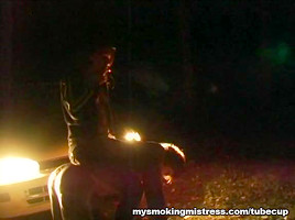 Smoking Mistress Sits on Slave