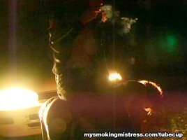 Smoking Mistress Sits on Slave
