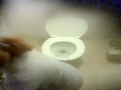 Three girls caught pissing in a public wc