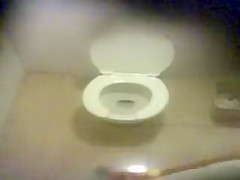 Three girls caught pissing in a public wc