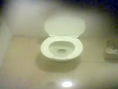 Three girls caught pissing in a public wc