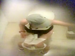 Three girls caught pissing in a public wc