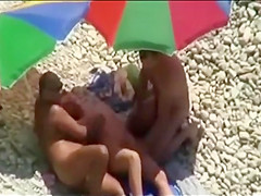 Threesome sex fun on public beach caught on cam