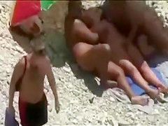 Threesome sex fun on public beach caught on cam