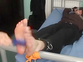 Tied to bed and tickled