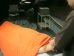 Topless model gets her body massaged onstage