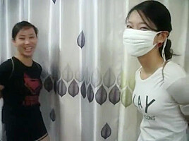 Two Chinese Girls Tied, One Wearing Cloth Mask