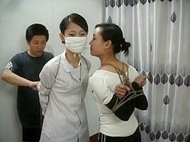 Two Chinese Girls Tied, One Wearing Cloth Mask
