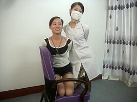 Two Chinese Girls Tied, One Wearing Cloth Mask