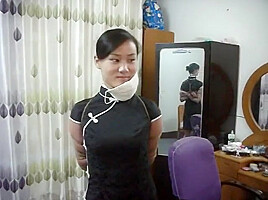Two Chinese Girls Tied, One Wearing Cloth Mask