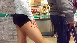 Volleyball player's deliciously round ass in line