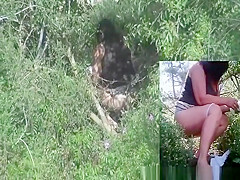 Woman spied peeing outdoors in the bushes