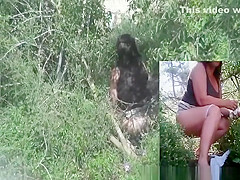Woman spied peeing outdoors in the bushes