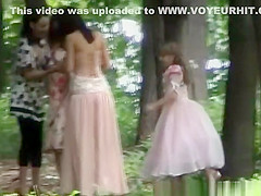 Women in ceremony clothes caught peeing