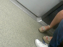 Young brunette, sexy legs in wedges heels