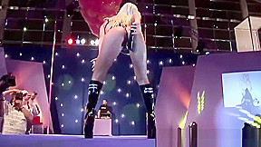 busty oiled Milf on public show stage