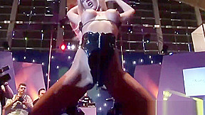 busty oiled Milf on public show stage