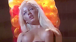 busty oiled Milf on public show stage