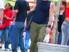 candid skinny tanned ad girl standing on the street in tight clothes