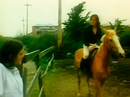 cowboy girl with long hair have sex on a stable
