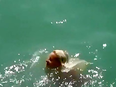 tapes a young nudist couple fucking at the beach